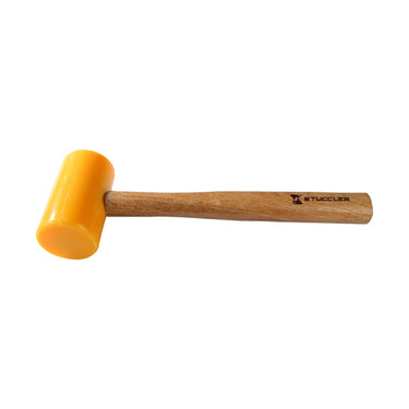 A horizontal view of a Stuccler yellow polyurethane dead blow mallet for jewelry making and metalwork.