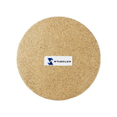 Top view of a round Stuccler Skamolex vermiculite insulation soldering pad for jewelry making