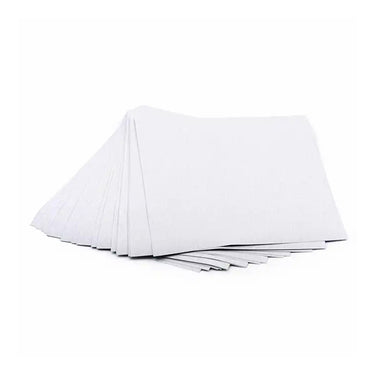 A stack of white dry abrasive emery paper sheets fanned out slightly on a clean white background.