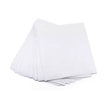 A stack of blank white sheets of dry abrasive emery paper isolated on a white background.