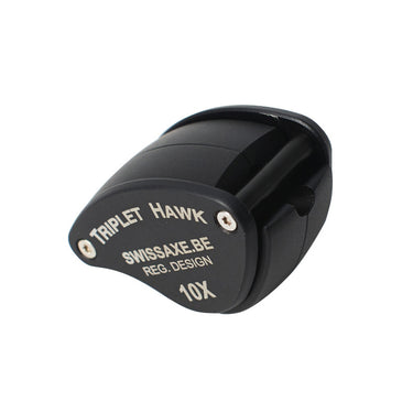 Closed view of the SwissAxe Triplet Hawk 10X loupe showing the registered design and compact triangular shape.