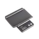 Tanita 1475T digital scale shown with its removable protective tray cover positioned above.