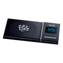 Tanita 1479J2 high-precision scale weighing several loose diamonds on the black platform.