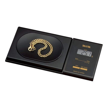 Tanita 1479V scale weighing a gold necklace, showing 25.1g on the digital display.