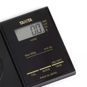 Close-up of Tanita 1479Z digital display showing 0.0g and weight unit options.