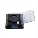Tanita KP-601 scale measuring loose gemstones with the digital readout set to carat (ct) mode.