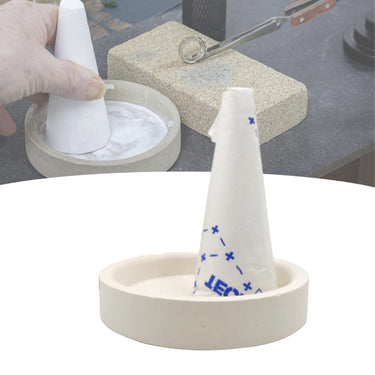 Technique ASIC borax cone and dish shown with a background demonstration of hand-grinding flux paste on a bench.
