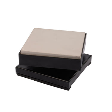 Technique ASIC rotating jewelry soldering table with square ceramic block tilted to the right.