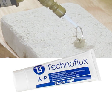 Technoflux AP paste tube shown with a background demonstration of torch soldering a ring shielded by the paste