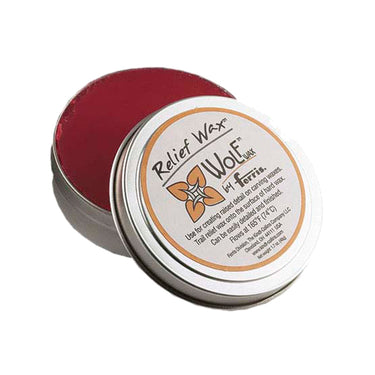 Close-up of open Wolf Relief Wax tin showing product instructions and red wax.