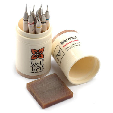 Wolf Micro Carvers in a canister shown with a brown wax carving block and a warning label on the lid.