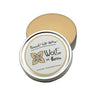 Open tin of Wolf's Touch-Up Wax by Ferris showing pale yellow wax with the branded lid resting on top.