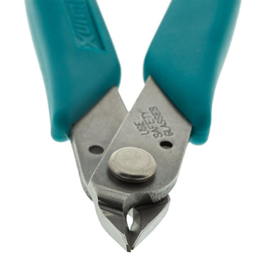 Detailed close-up of the polished, mirror-like cutting blades of the Xuron 410.