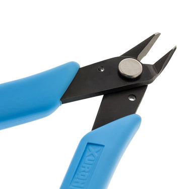 Angled view of Xuron flush cutter with blades open, showing the high-carbon steel construction.