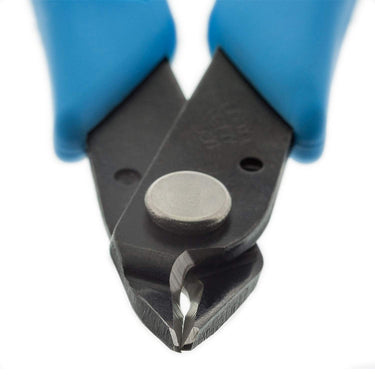 Macro close-up of Xuron flush cutter blades showing the precision shear cutting tip.