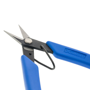 Close-up of the sharp, smooth blades on a Xuron precision scissor for clean cuts in jewelry making.